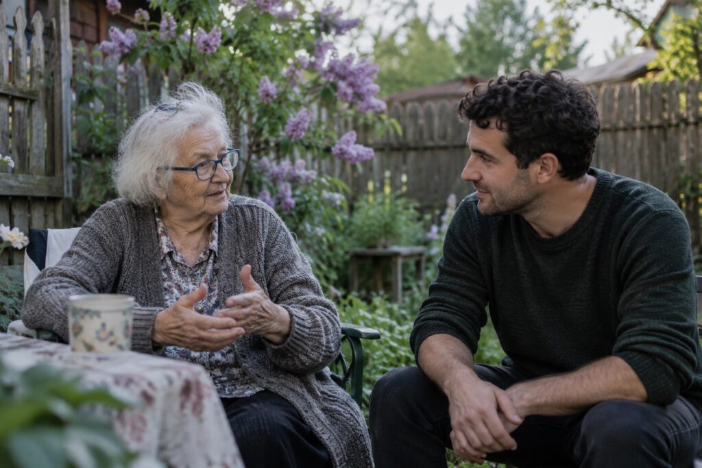Babcia i dorosły wnuk rozmawiający w ogrodzie